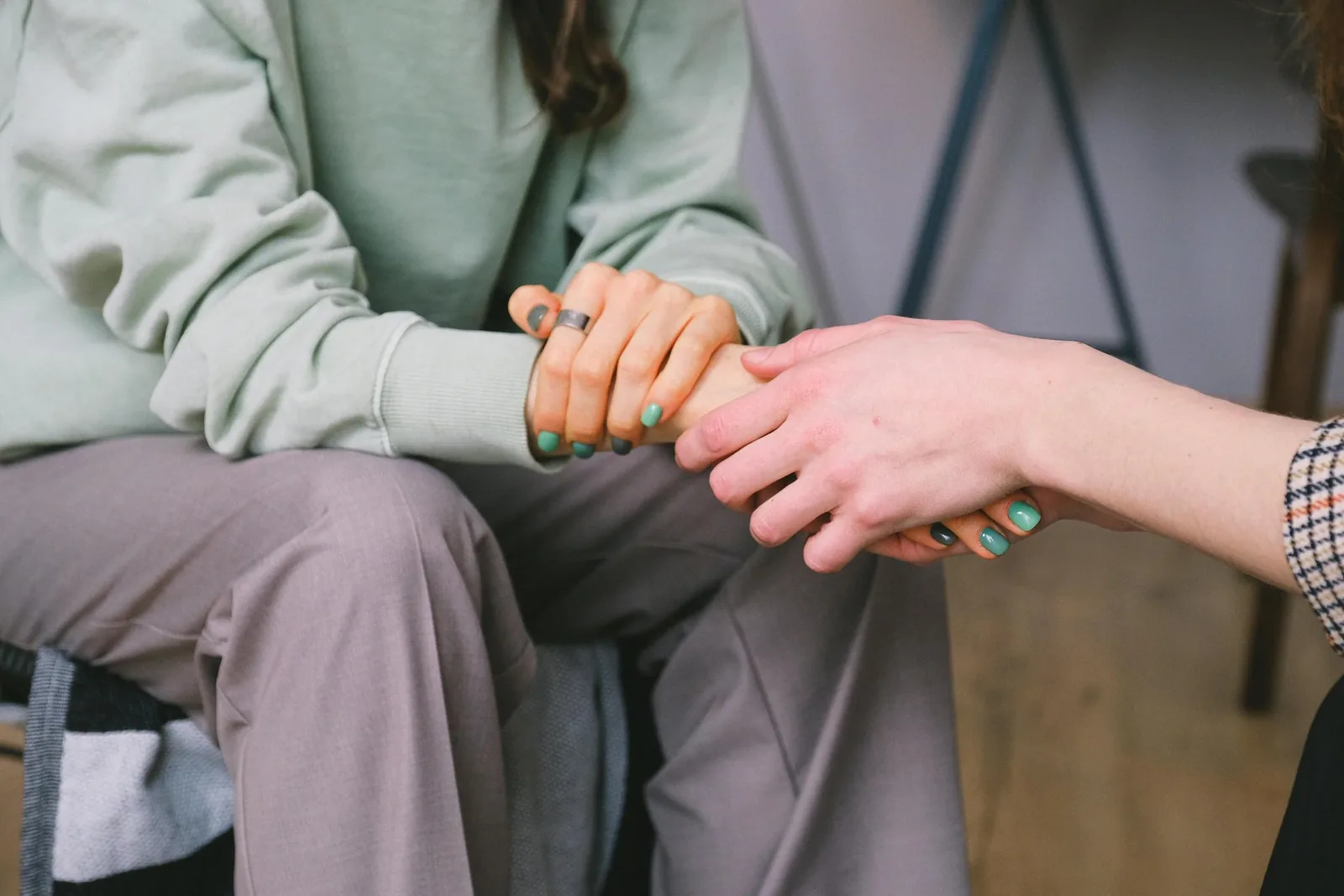 Hands held in support, trauma therapy at Life Threads Therapy in West Los Angeles