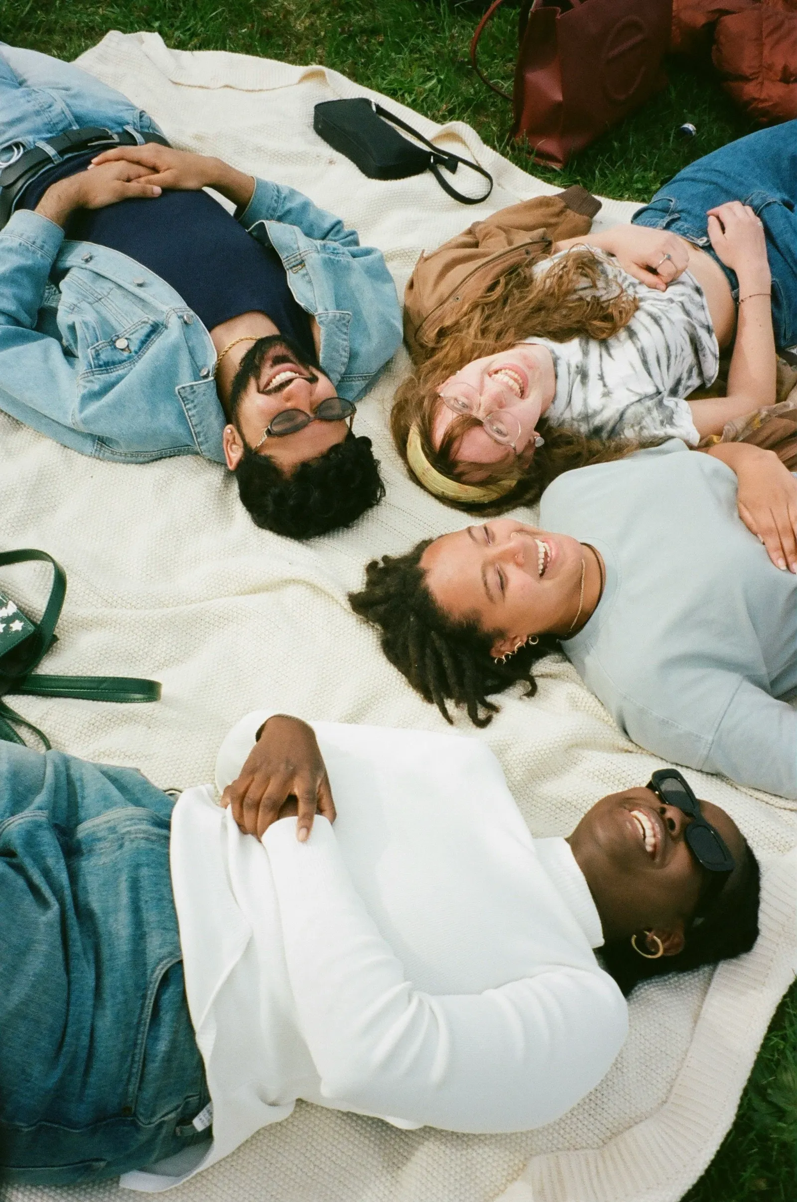 Group of people connecting outdoors, representing relational healing at Life Threads Therapy